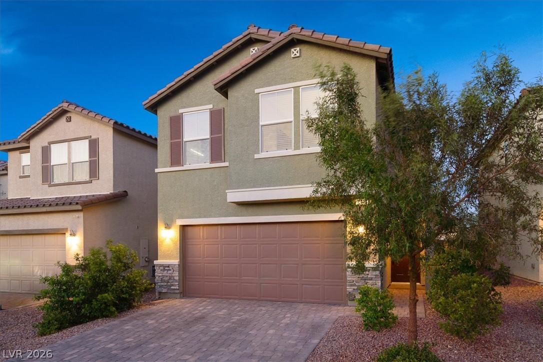 Image 4: A striking modern exterior with an inviting paved