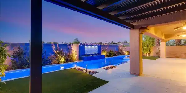 Image 3: An inviting pool area features a captivating tiled