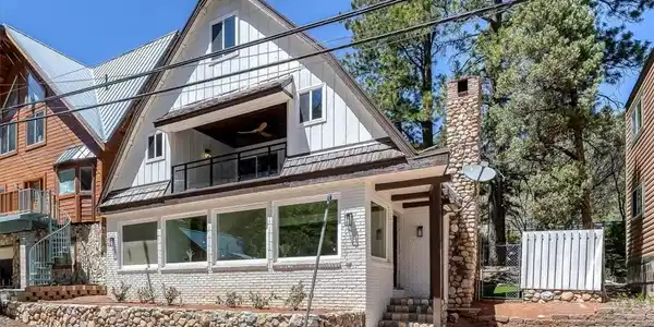Image 2: This charming residence features distinct architec