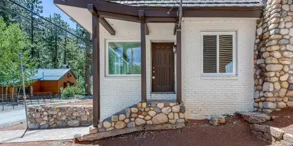 Image 3: This charming home offers a cozy entryway and dura