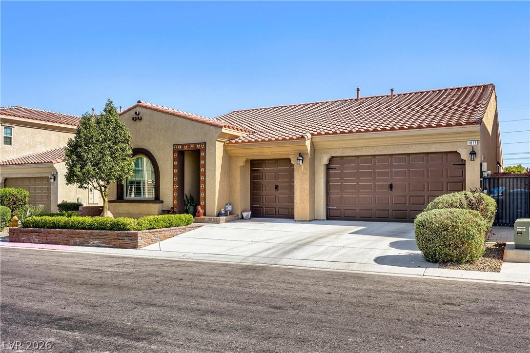 Image 2: This charming residence features an inviting exter