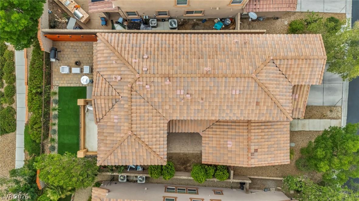 Image 4: An aerial perspective reveals a tile roof and a pr