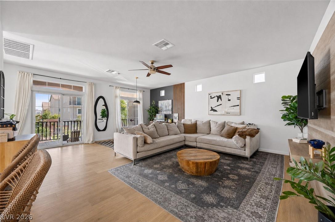 Image 2: A welcoming living area featuring durable hardwood