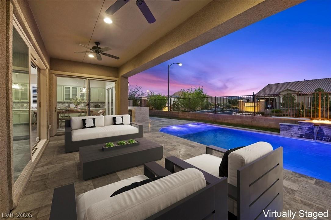 Image 3: An inviting covered patio offers an exceptional en