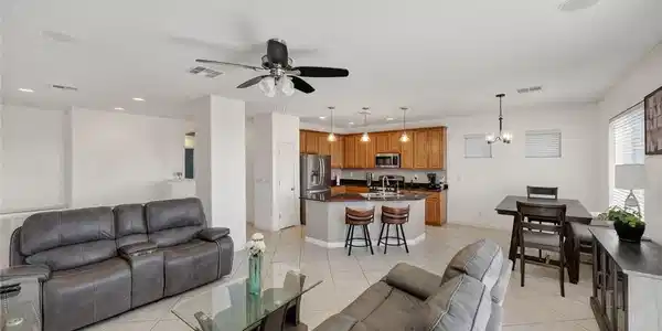 Image 2: This bright living area features an open floor pla