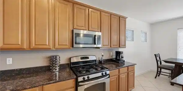 Image 4: This functional kitchen provides a gas range, micr
