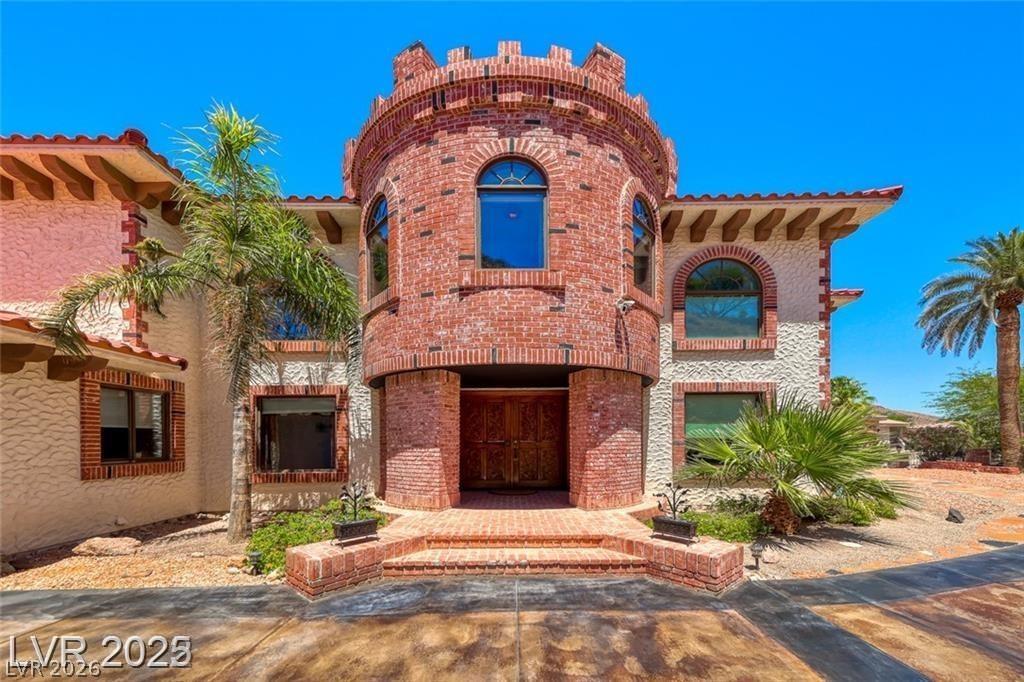Image 2: This unique brick-clad residence features a distin