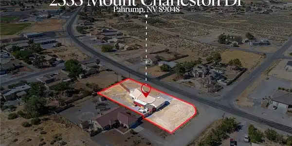 Image 2: Perched on an expansive corner lot, this desert pr