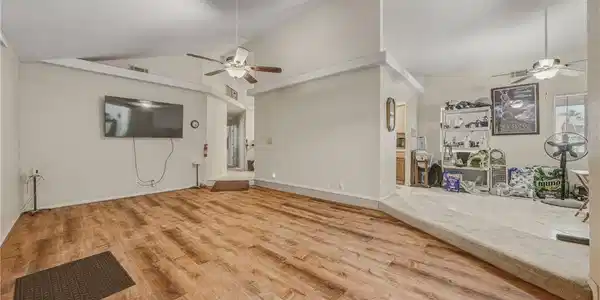 Image 4: Varying floor levels distinguish spaces in this ho