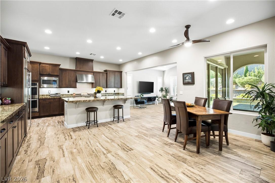 Image 4: Well-appointed kitchen and dining area feature ric