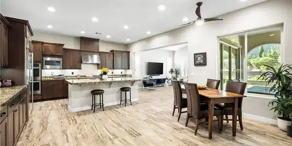 Image 4: Well-appointed kitchen and dining area feature ric
