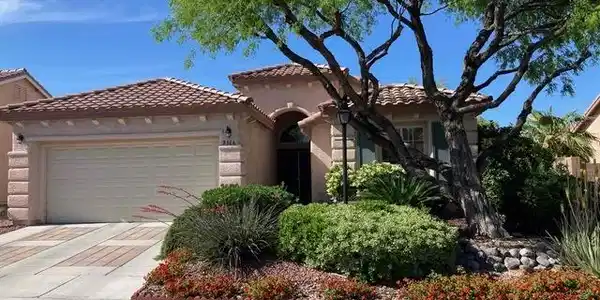Image 3: Spanish tile roofing and custom driveway detail en