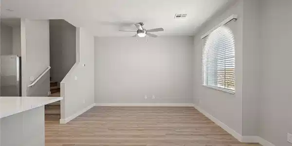 Image 2: Clean lines and smooth wood floors define this ope