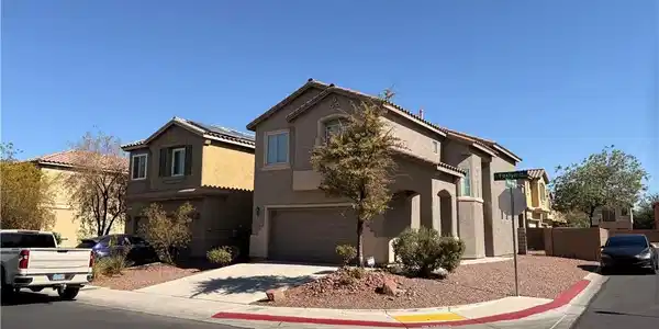 Image 2: A corner lot residence boasts desert-friendly land