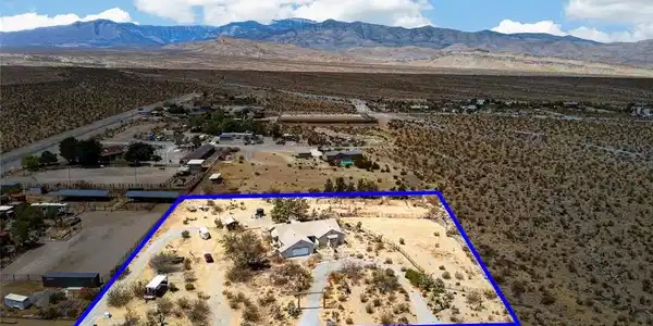 Image 2: A desert oasis with a private residence and vast s
