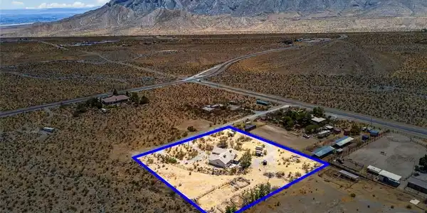 Image 3: A desert oasis home, bordered by a distinct proper
