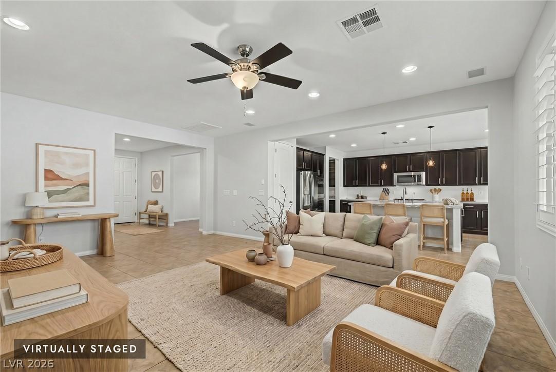 Image 3: An open floorplan seamlessly connects the living r