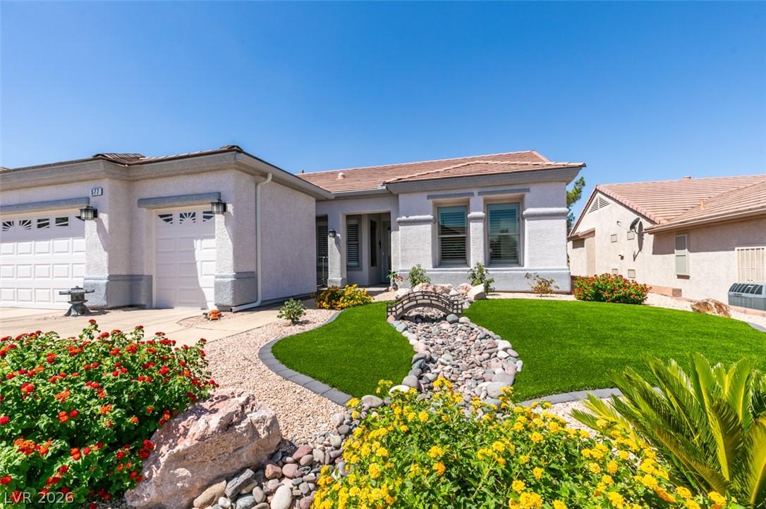Image 3: A meticulously maintained front yard features vibr