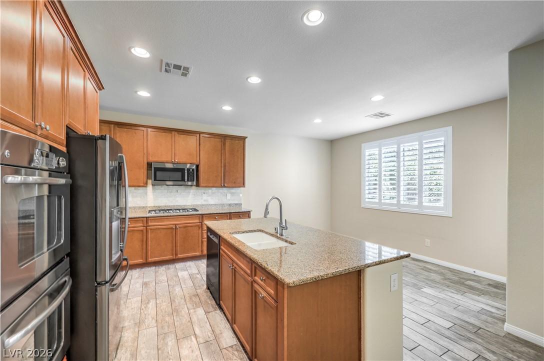 Image 3: A well-appointed kitchen showcasing rich cabinetry