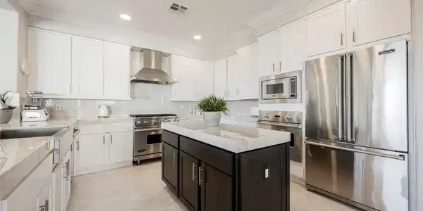 Image 3: Soaring 2-story cathedral ceilings & a winding sta