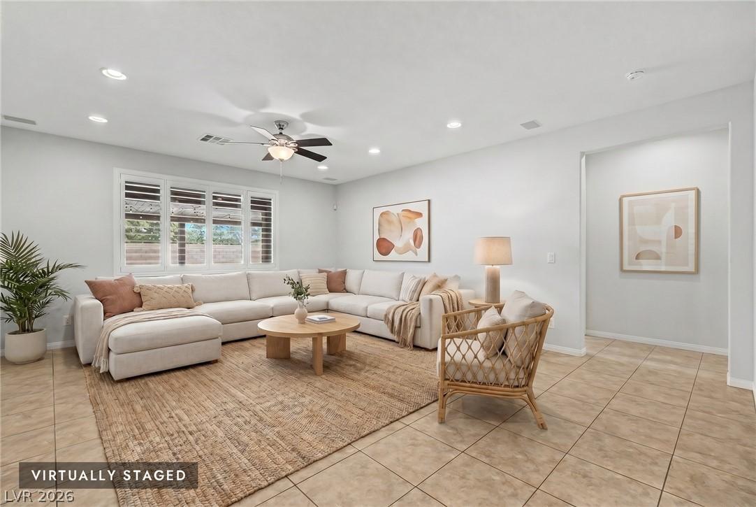 Image 4: Sun-filled living space with recessed lighting and
