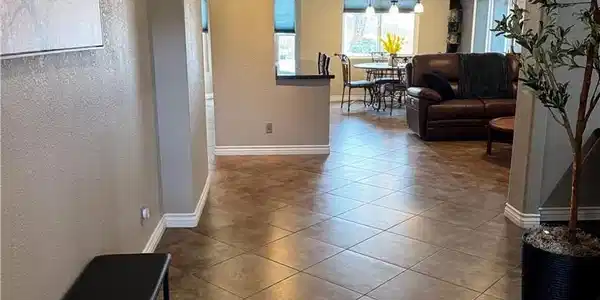 Image 3: A flowing layout with warm tiled flooring guides y
