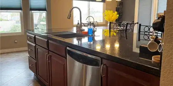 Image 4: A well-appointed kitchen island offers a stainless