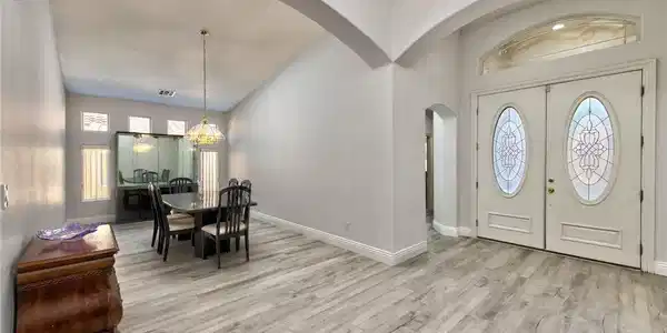 Image 3: A spacious formal entryway flows effortlessly into