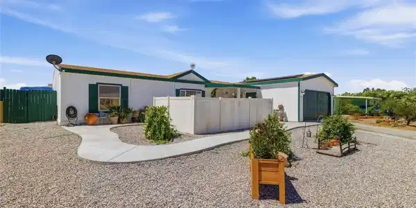 Image 3: A well-maintained residence features a concrete pa