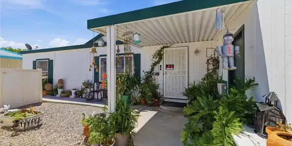 Image 4: A well-maintained manufactured home with a covered