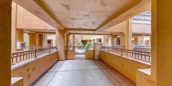 Image 4: Covered concrete walkways overlook the central cou