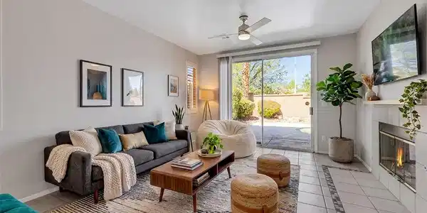 Image 2: Sliding glass doors connect the tiled living area