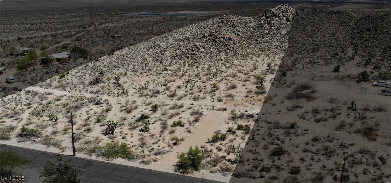 Image 1: Aerial view of sparsely populated area featuring a
