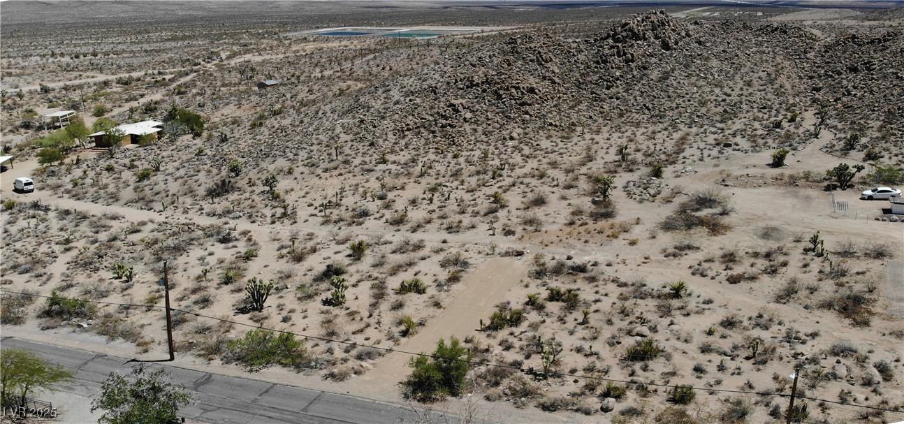 Image 2: View of rural area featuring a desert landscape an