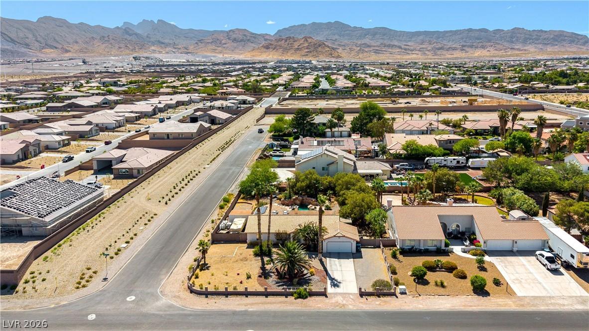 Image 3: An aerial perspective reveals a desert neighborhoo