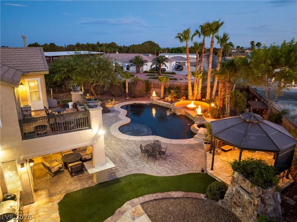 Image 2: An inviting backyard oasis showcases a resort-styl