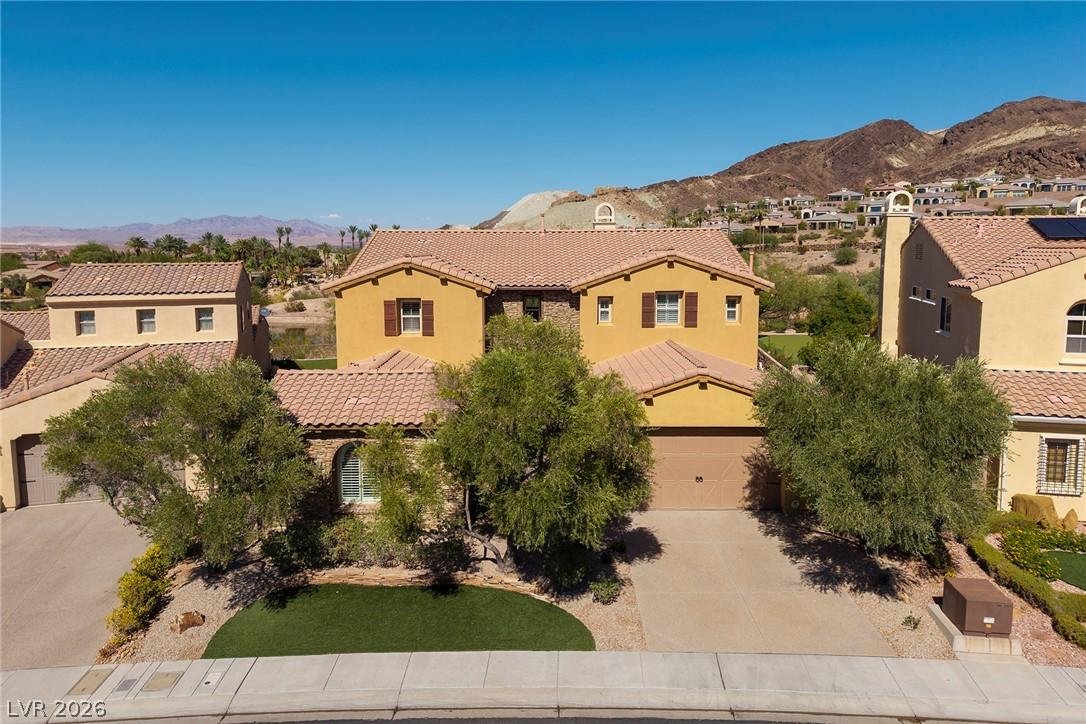 Image 2: A desert oasis, this two-story residence presents