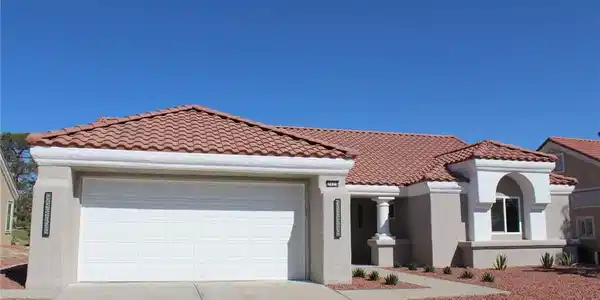 Image 2: This desert oasis features a classic tiled roof an