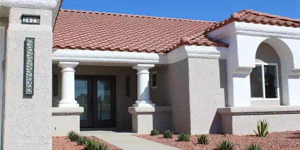 Image 3: Enter this home through an inviting facade with cl