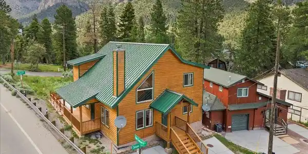 Image 2: Featuring four bedrooms + two bathrooms, soaring