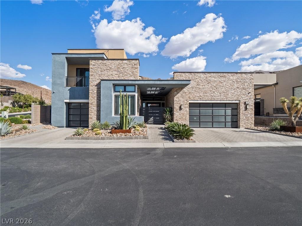 Image 1: Modern desert architecture combines stone and stuc