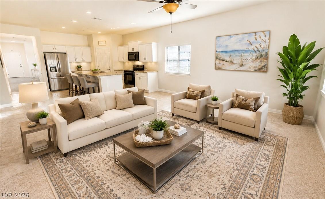 Image 2: An inviting open-concept living area with a bright