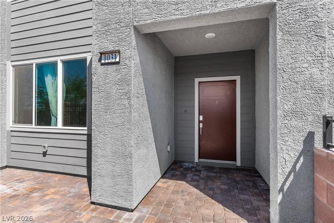 Image 4: A welcoming entry courtyard with modern textures a