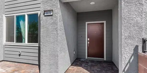 Image 4: A welcoming entry courtyard with modern textures a