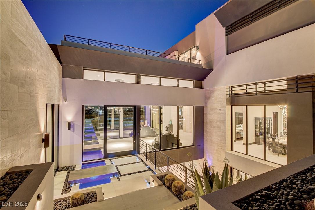 Image 2: Entrance to property featuring stucco siding