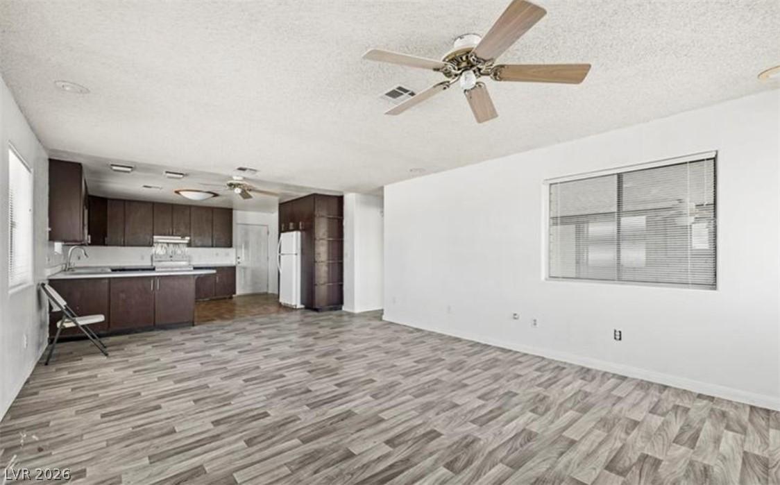 Image 3: This bright, open concept living space features a