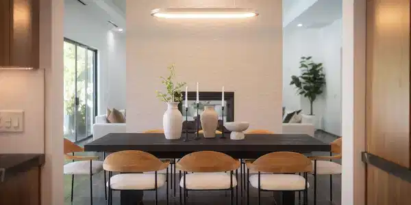 Image 2: A sophisticated dining area showcases a sleek, dar