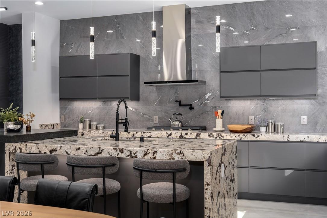 Image 2: This kitchen showcases a central island, sleek cab