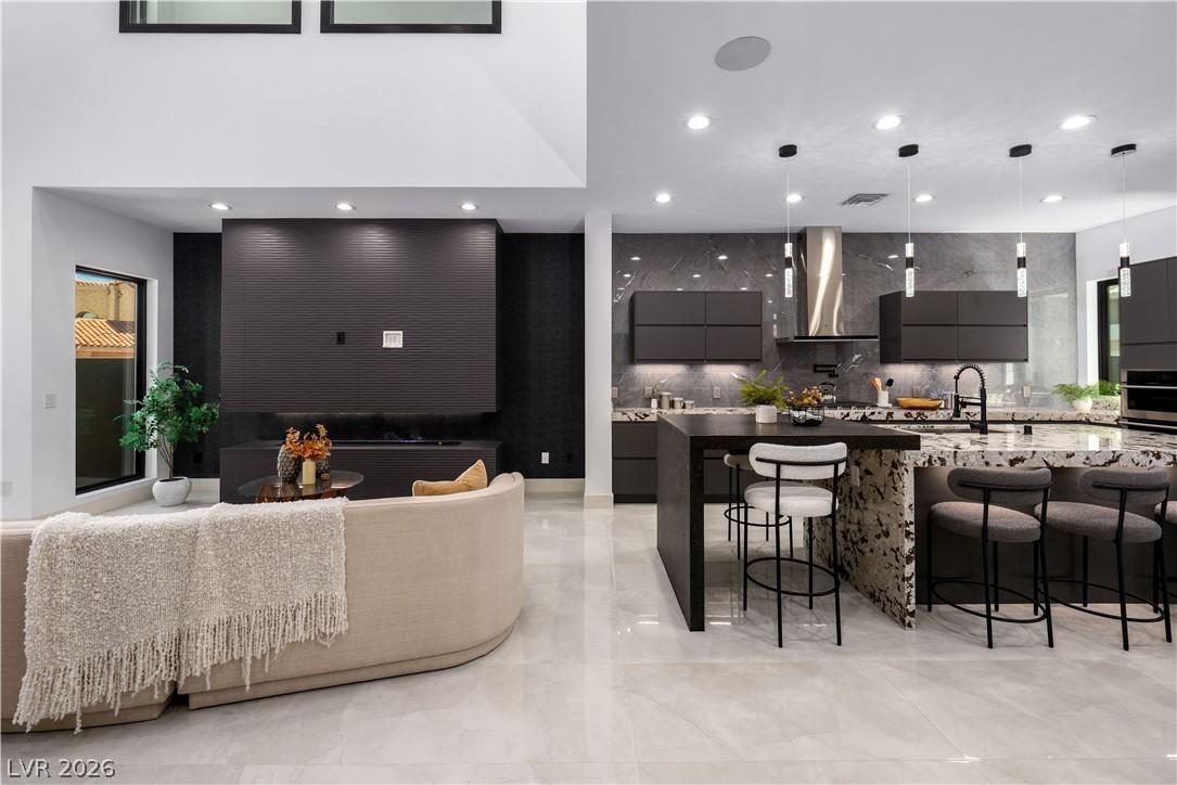 Image 4: This open concept living space features a modern k