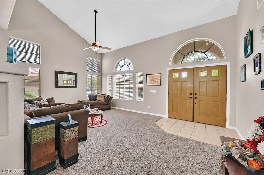 Image 3: An inviting entry opens to a spacious living room